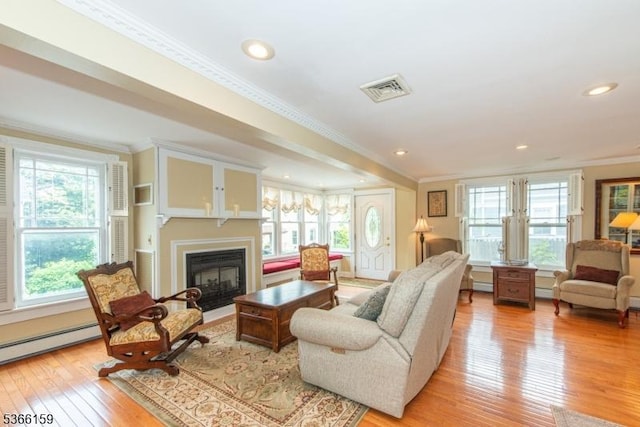 6 Mc Clintock Pl, Parsippany-Troy Hills Twp, NJ 07878 - living area featuring ornamental molding, healthy amount of natural light, light wood-style flooring, a baseboard heating unit, and a glass covered fireplace