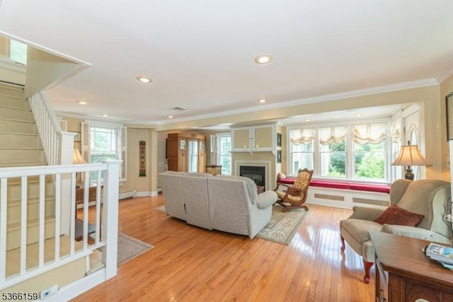 6 Mc Clintock Pl, Parsippany-Troy Hills Twp, NJ 07878 - living room with ornamental molding, plenty of natural light, a fireplace, light wood-style floors, and stairway