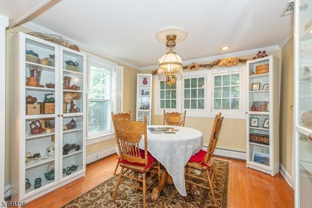 6 Mc Clintock Pl, Parsippany-Troy Hills Twp, NJ 07878 - dining space with baseboard heating, crown molding, a chandelier, and light wood finished floors