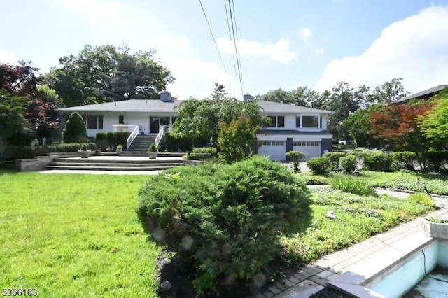 204 Crestwood Dr, South Orange Village Twp, NJ 07079 - rear view of property featuring an attached garage, a lawn, and stairway