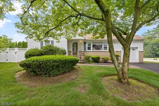 3 Casey Ave, East Hanover Twp, NJ 07936 - view of front of house featuring brick siding, an attached garage, and asphalt driveway
