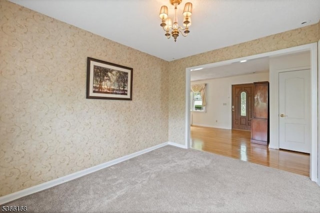 3 Casey Ave, East Hanover Twp, NJ 07936 - empty room featuring carpet, a chandelier, and wallpapered walls