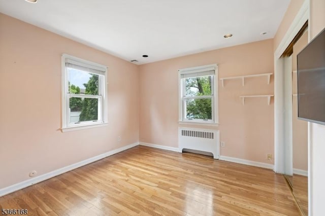 3 Casey Ave, East Hanover Twp, NJ 07936 - unfurnished bedroom with radiator heating unit and light wood finished floors