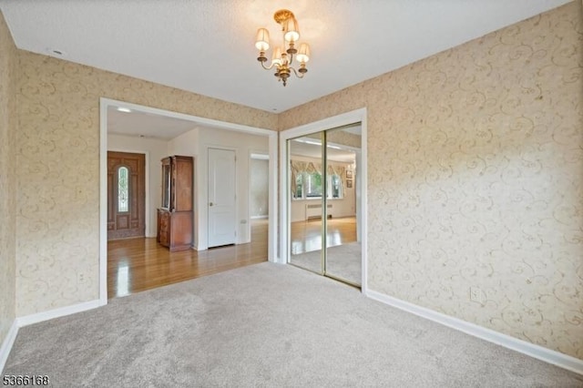 3 Casey Ave, East Hanover Twp, NJ 07936 - carpeted empty room featuring a chandelier and baseboards