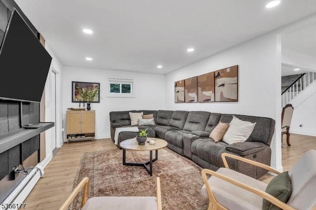 24 Roxbury Dr, Roxbury Twp, NJ 07847 - living room featuring a baseboard heating unit, light wood-type flooring, recessed lighting, and stairs