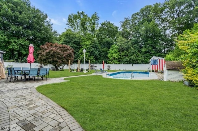 24 Roxbury Dr, Roxbury Twp, NJ 07847 - fenced backyard with a storage shed, a patio area, and outdoor dining area