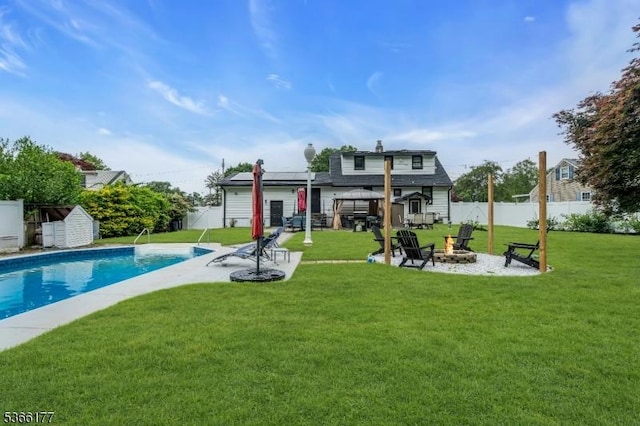 24 Roxbury Dr, Roxbury Twp, NJ 07847 - rear view of property with a fire pit, a fenced backyard, a gazebo, a patio area, and a storage unit