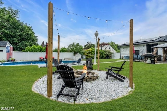 24 Roxbury Dr, Roxbury Twp, NJ 07847 - fenced backyard with a fire pit, a storage shed, and a patio area