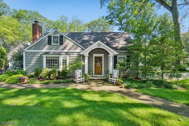 33 Tall Oaks Dr, New Providence Boro, NJ 07901 - view of front of home featuring a chimney and a front yard