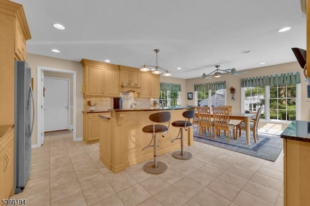 2 Kerry Pl, Mount Olive Twp, NJ 07836 - kitchen featuring freestanding refrigerator, light brown cabinetry, a breakfast bar area, ceiling fan, and recessed lighting