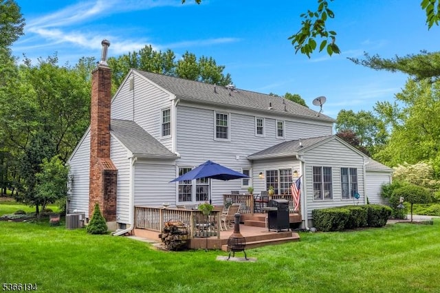 2 Kerry Pl, Mount Olive Twp, NJ 07836 - rear view of property featuring a chimney, a wooden deck, a yard, and a shingled roof