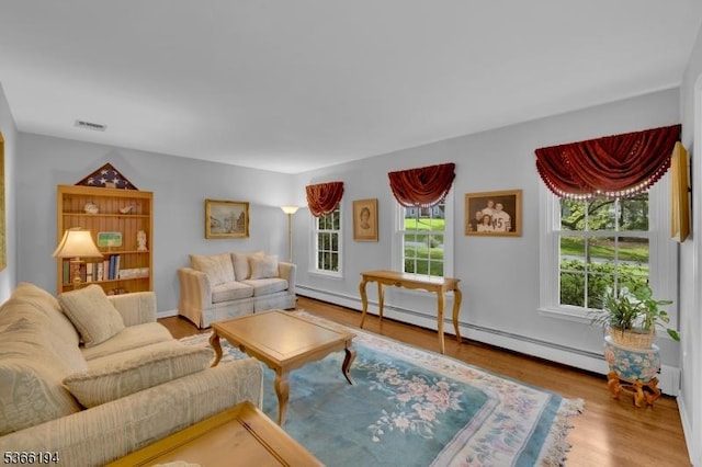 2 Kerry Pl, Mount Olive Twp, NJ 07836 - living area with wood finished floors and a baseboard heating unit