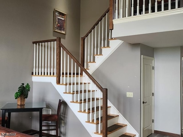 1-23 Pine Cres Unit 23, Vernon Twp, NJ 07462 - stairway with a high ceiling and wood finished floors