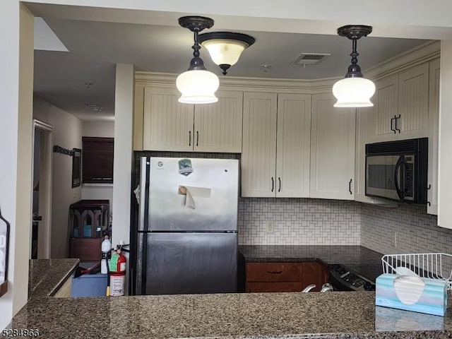 1-23 Pine Cres Unit 23, Vernon Twp, NJ 07462 - kitchen with freestanding refrigerator, black microwave, backsplash, and dark stone counters