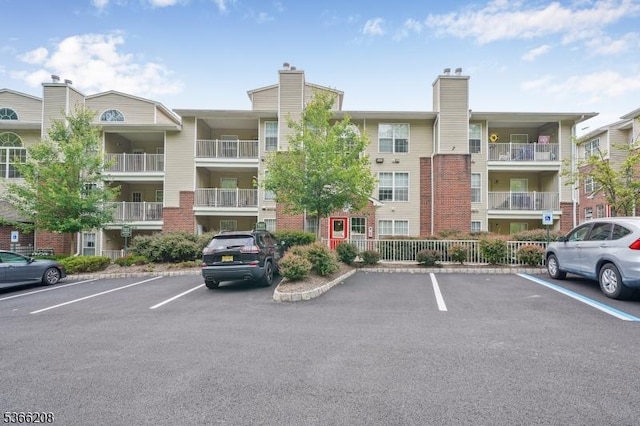 2112 Schindler Ln, Wayne Twp, NJ 07470 - view of apartment building / complex featuring uncovered parking