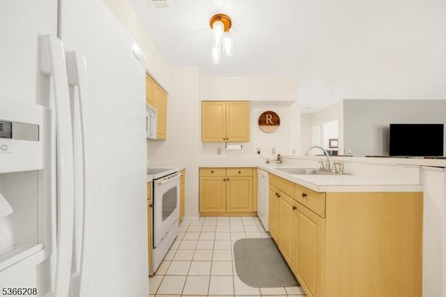 2112 Schindler Ln, Wayne Twp, NJ 07470 - kitchen featuring white appliances, light brown cabinets, light tile patterned floors, and a peninsula