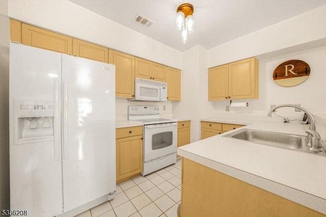 2112 Schindler Ln, Wayne Twp, NJ 07470 - kitchen featuring white appliances, light brown cabinets, light tile patterned floors, and light countertops
