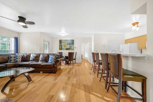 2112 Schindler Ln, Wayne Twp, NJ 07470 - living room featuring light wood finished floors and ceiling fan