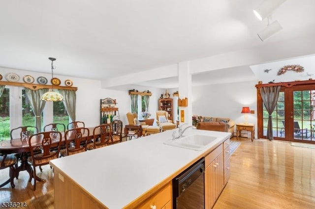 33 Kings Hwy, Washington Twp, NJ 07853 - kitchen with dishwasher, open floor plan, light wood finished floors, light countertops, and plenty of natural light