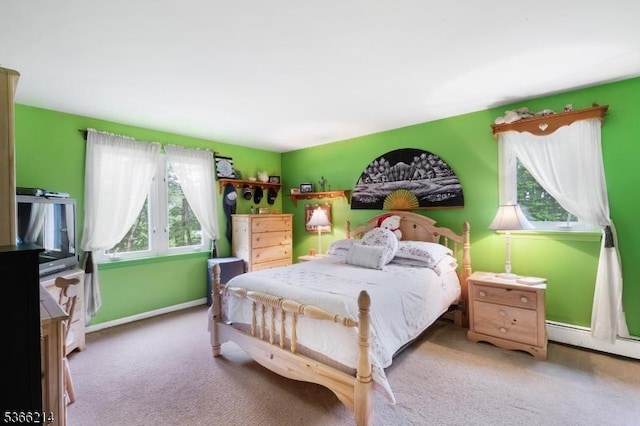 33 Kings Hwy, Washington Twp, NJ 07853 - bedroom with multiple windows, carpet, and a baseboard heating unit