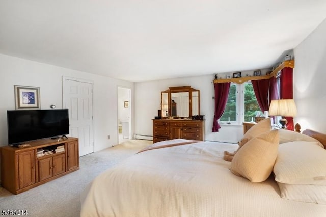 33 Kings Hwy, Washington Twp, NJ 07853 - bedroom featuring light colored carpet, a baseboard radiator, and connected bathroom