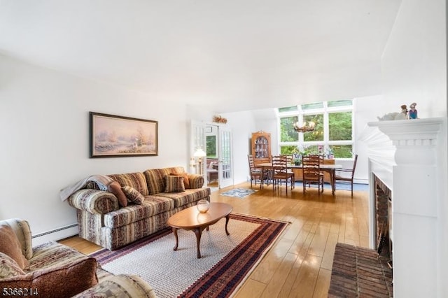 33 Kings Hwy, Washington Twp, NJ 07853 - living area with baseboard heating, hardwood / wood-style floors, and a chandelier