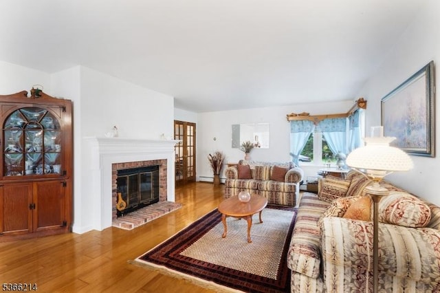 33 Kings Hwy, Washington Twp, NJ 07853 - living area with wood finished floors, a fireplace, and a baseboard radiator