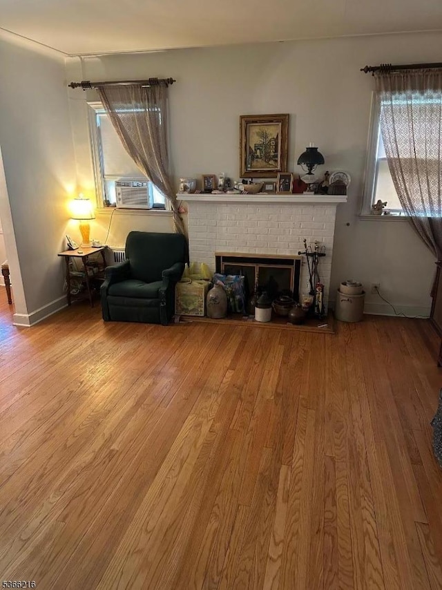 4 Hampton Pl, Nutley Twp, NJ 07110 - living area featuring wood finished floors, a brick fireplace, and cooling unit