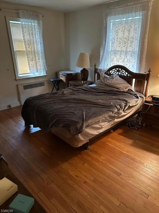 4 Hampton Pl, Nutley Twp, NJ 07110 - bedroom featuring radiator heating unit and hardwood / wood-style floors