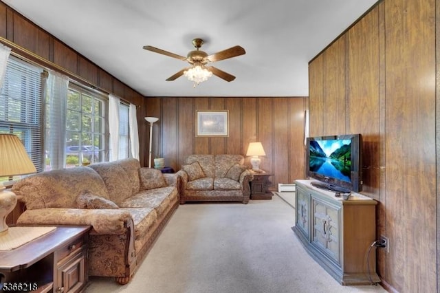 15 Stony Brook Rd, Byram Twp, NJ 07874 - living room featuring ceiling fan, a baseboard heating unit, wood walls, and light colored carpet