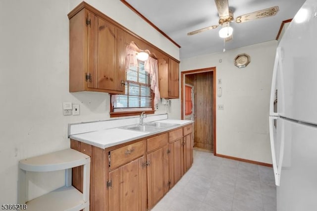15 Stony Brook Rd, Byram Twp, NJ 07874 - kitchen with freestanding refrigerator, light countertops, a ceiling fan, and brown cabinets