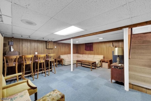 15 Stony Brook Rd, Byram Twp, NJ 07874 - living area featuring carpet floors, wooden walls, a drop ceiling, a dry bar, and stairway