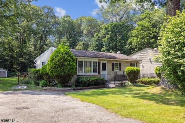 15 Stony Brook Rd, Byram Twp, NJ 07874 - view of front of house with a front yard and a shed