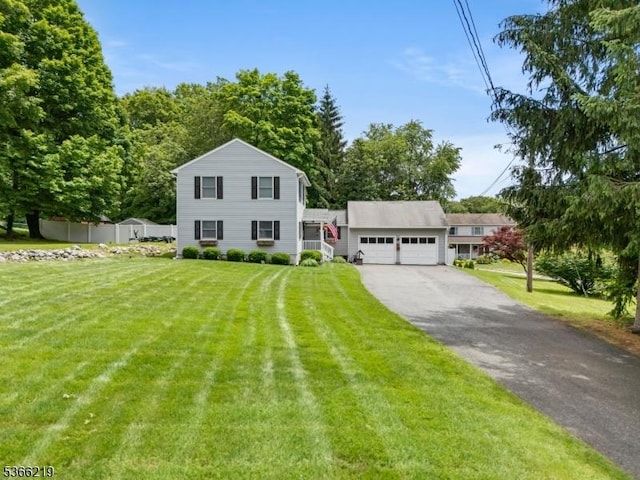 12 Ridge Rd, West Milford Twp, NJ 07480 - view of front of home featuring a front lawn, a garage, and asphalt driveway