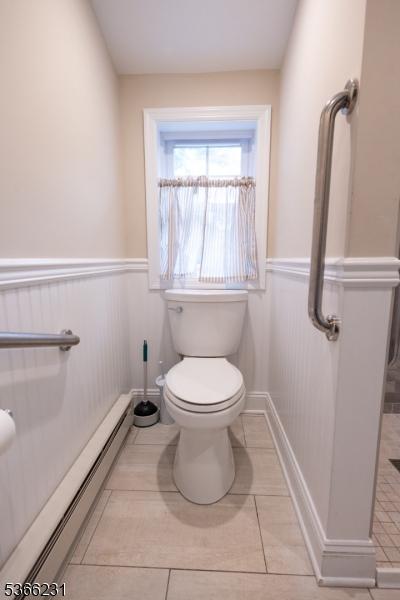 48 Keller Ave, Rockaway Boro, NJ 07866 - bathroom featuring a baseboard radiator, wainscoting, and tile patterned flooring