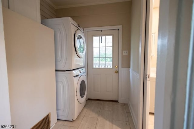 48 Keller Ave, Rockaway Boro, NJ 07866 - washroom with stacked washer / drying machine, light tile patterned floors, wainscoting, and crown molding