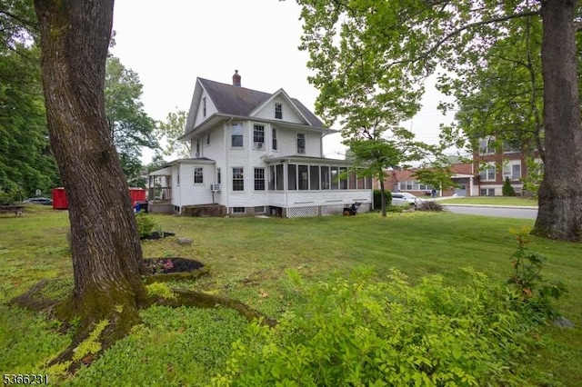 48 Keller Ave, Rockaway Boro, NJ 07866 - rear view of house with a chimney, a sunroom, and a yard