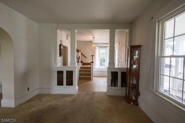 48 Keller Ave, Rockaway Boro, NJ 07866 - unfurnished living room featuring carpet, stairs, and arched walkways