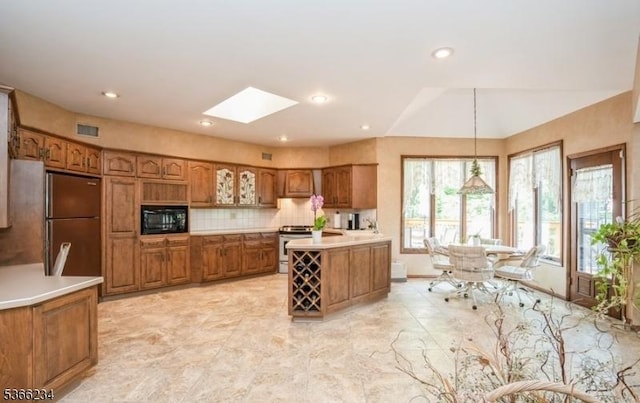 856 Colonial Arms Rd, Union Twp, NJ 07083 - kitchen with appliances with stainless steel finishes, brown cabinets, light countertops, tasteful backsplash, and recessed lighting
