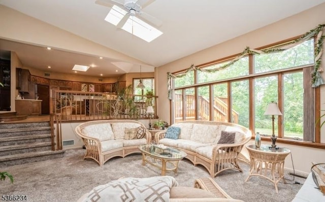 856 Colonial Arms Rd, Union Twp, NJ 07083 - carpeted living area with vaulted ceiling, ceiling fan, a skylight, and stairs