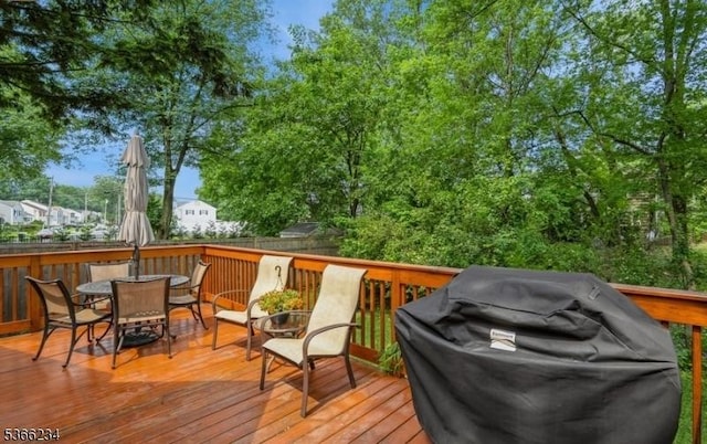 856 Colonial Arms Rd, Union Twp, NJ 07083 - wooden terrace with grilling area and outdoor dining space