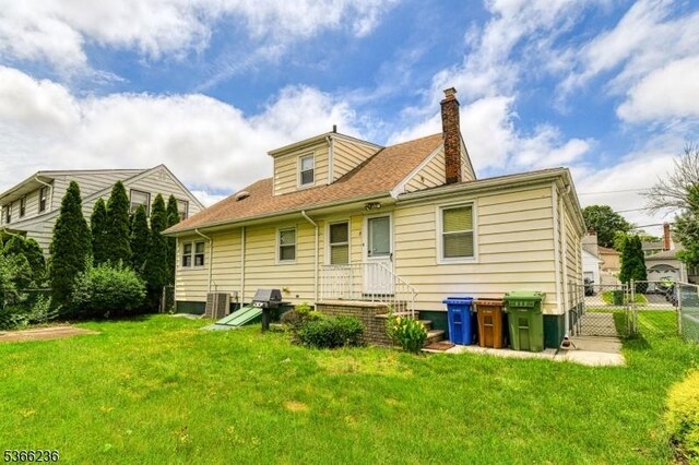 21 Academy Ter, Linden City, NJ 07036 - rear view of property with a chimney and a gate