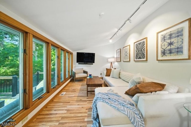 86 Riverside Dr, Denville Twp, NJ 07834 - living area featuring light wood finished floors, vaulted ceiling, and track lighting