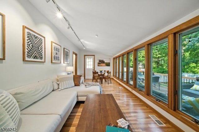 86 Riverside Dr, Denville Twp, NJ 07834 - living room with track lighting, wood finished floors, and lofted ceiling