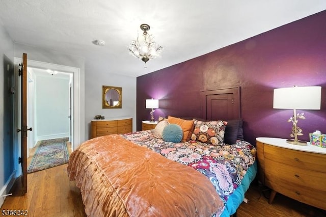 86 Riverside Dr, Denville Twp, NJ 07834 - bedroom featuring wood finished floors and a chandelier