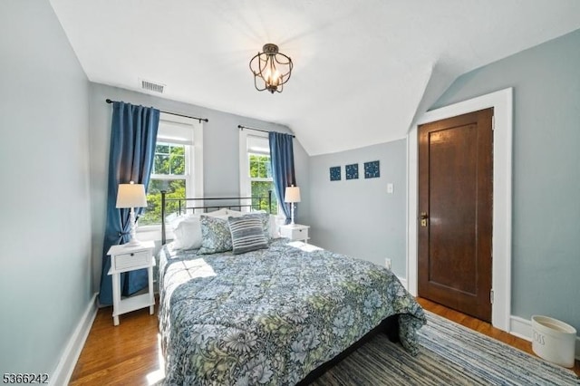 86 Riverside Dr, Denville Twp, NJ 07834 - bedroom featuring wood finished floors and vaulted ceiling