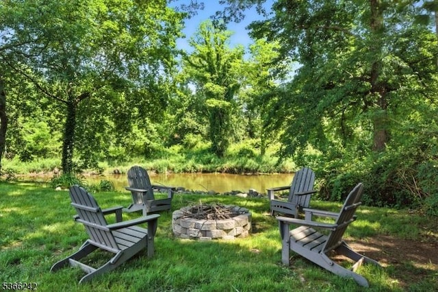 86 Riverside Dr, Denville Twp, NJ 07834 - view of green lawn featuring an outdoor fire pit