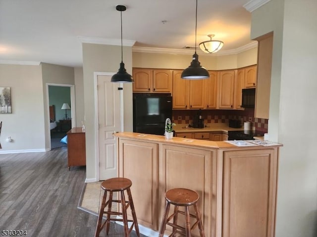 7-11 Maple Cres Unit 11, Vernon Twp, NJ 07462 - kitchen featuring black appliances, tasteful backsplash, crown molding, dark wood-type flooring, and light countertops