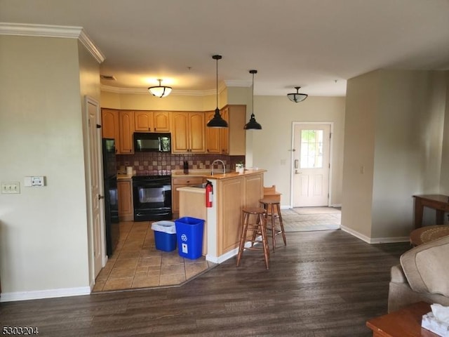 7-11 Maple Cres Unit 11, Vernon Twp, NJ 07462 - kitchen with black microwave, range, wood finished floors, a kitchen bar, and open floor plan