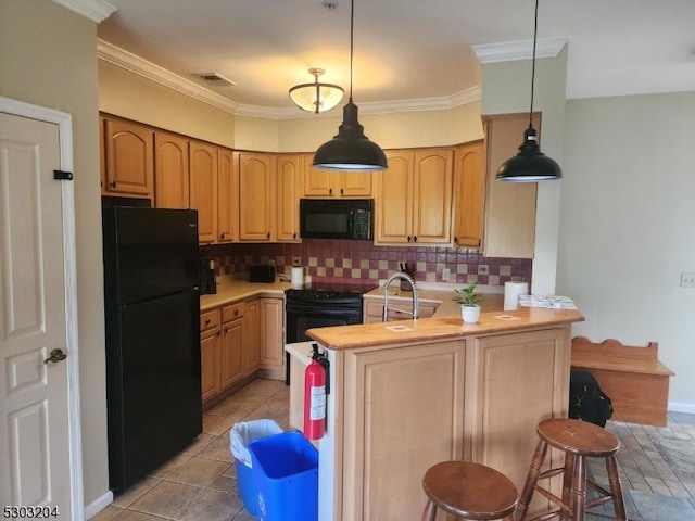 7-11 Maple Cres Unit 11, Vernon Twp, NJ 07462 - kitchen featuring black appliances, tasteful backsplash, a kitchen bar, light countertops, and a peninsula